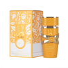 A luxurious product shot featuring the vibrant Lattafa Yara Tous perfume oil bottle placed next to its elegant packaging, showcasing the tropical-inspired aesthetic and premium quality of this fragrance set.